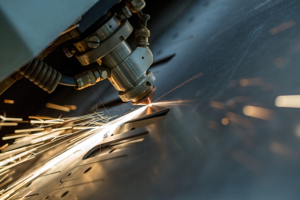 Fiber laser cutting a stainless steel sheet on the fabrication floor in Las Vegas